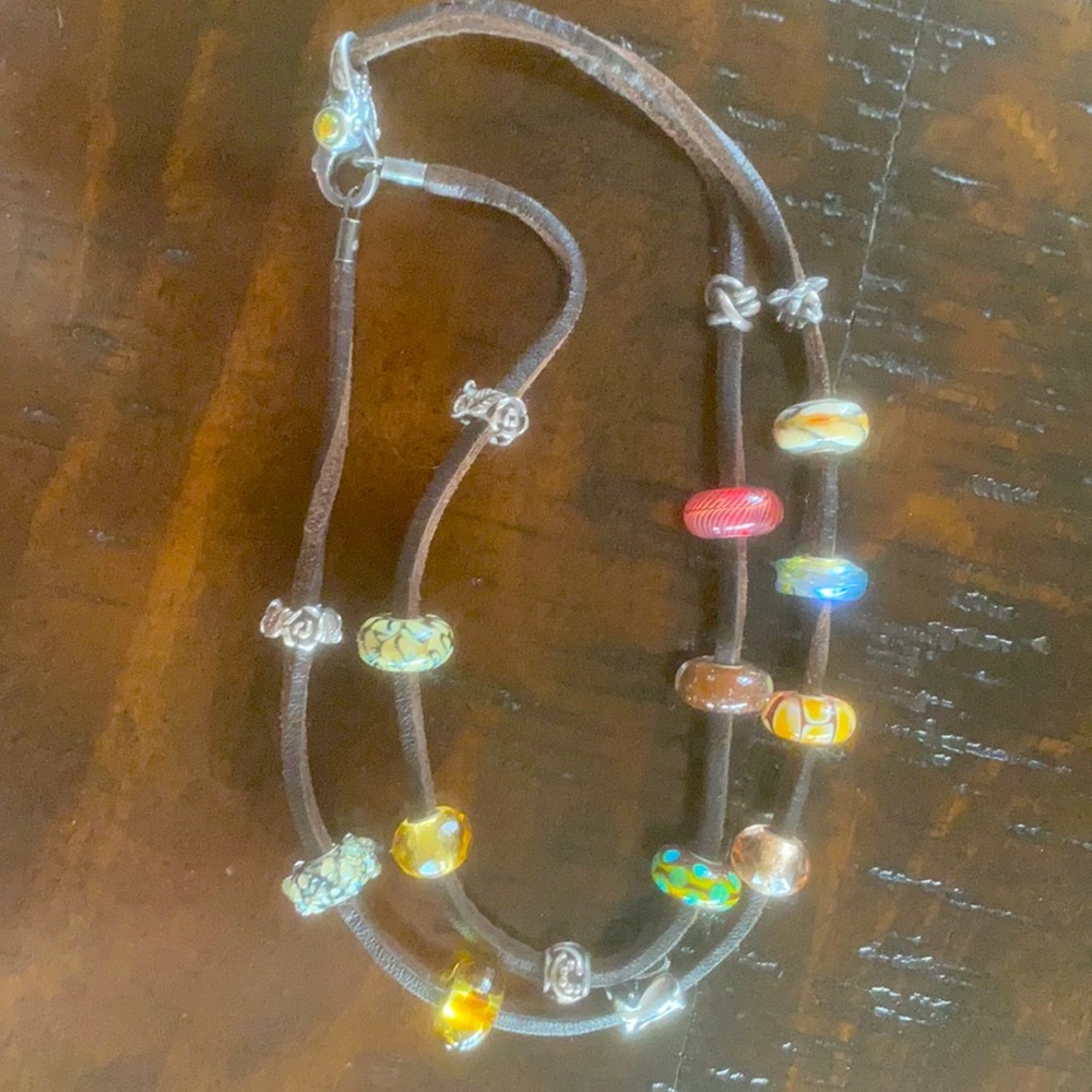 Troll beads with leather wrap and clasp.